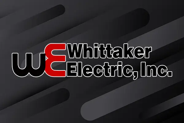 The Whittaker Electric company logo with a dark background